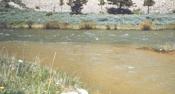 "Sediment pollution is showcased in a river"