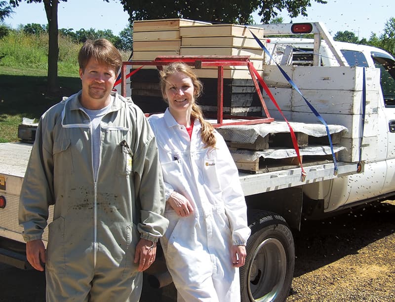 Tim McDonald and his wife, Dana, in front of a truck