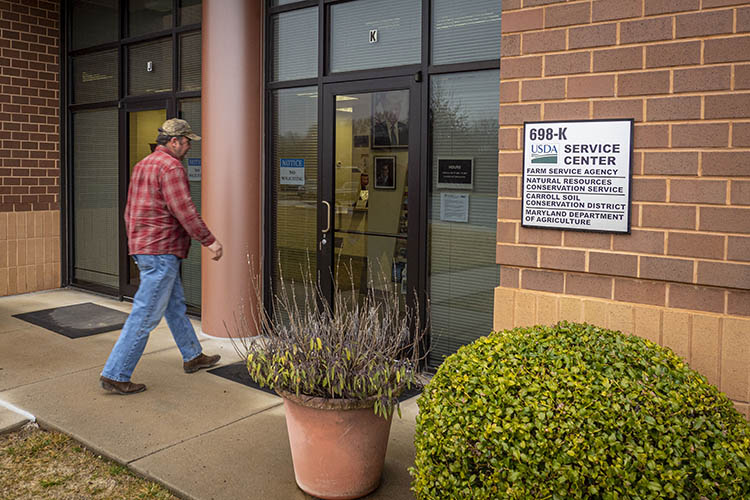 A customer walks into a USDA Service Center. 