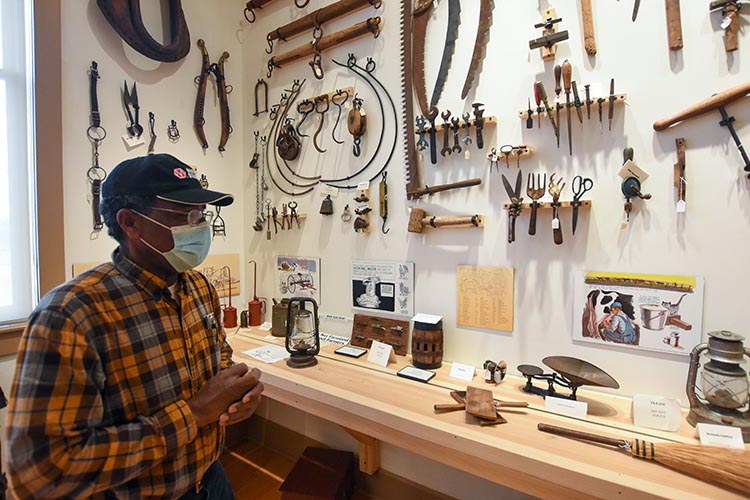 Stanley talks about the history of agriculture in in front of a display similar to the one honoring Lyles Station in the National Museum of African American History and Culture in Washington D.C