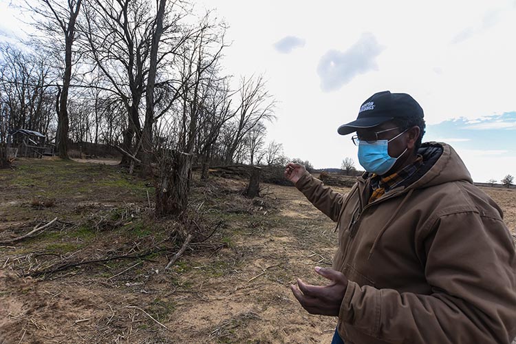 Stanley reviews the site where the museum's high tunnel will be built in the spring with Stephanie Mitchell, NRCS district conservationist. 