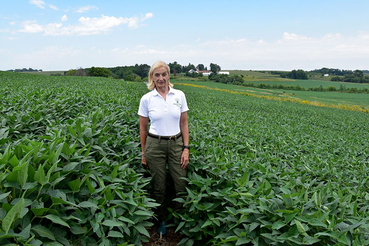 Maggie McQuown in a soybean field on her family’s Century Farm in Iowa.