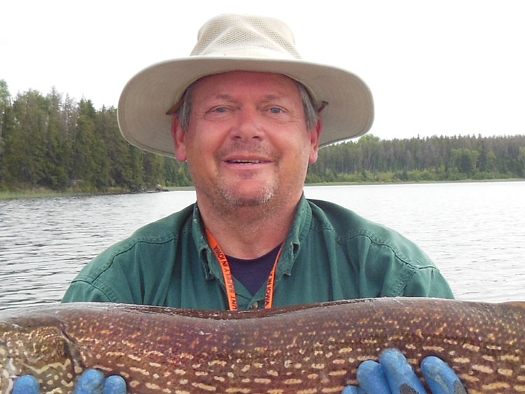 Rich Strait holds his fishing catch.