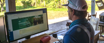 A producer working on a computer