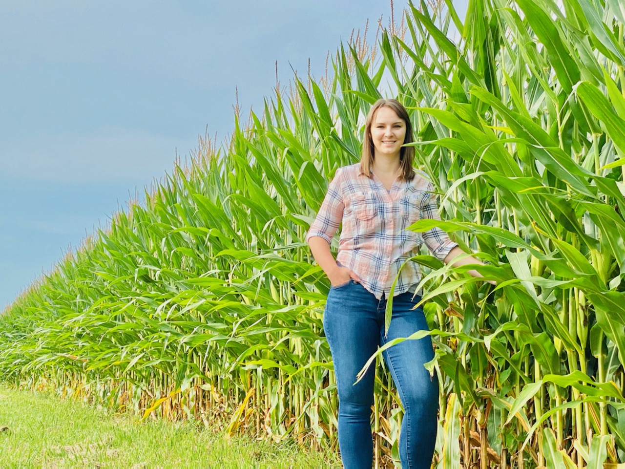 Adrienne Steinacher stands in vineyard