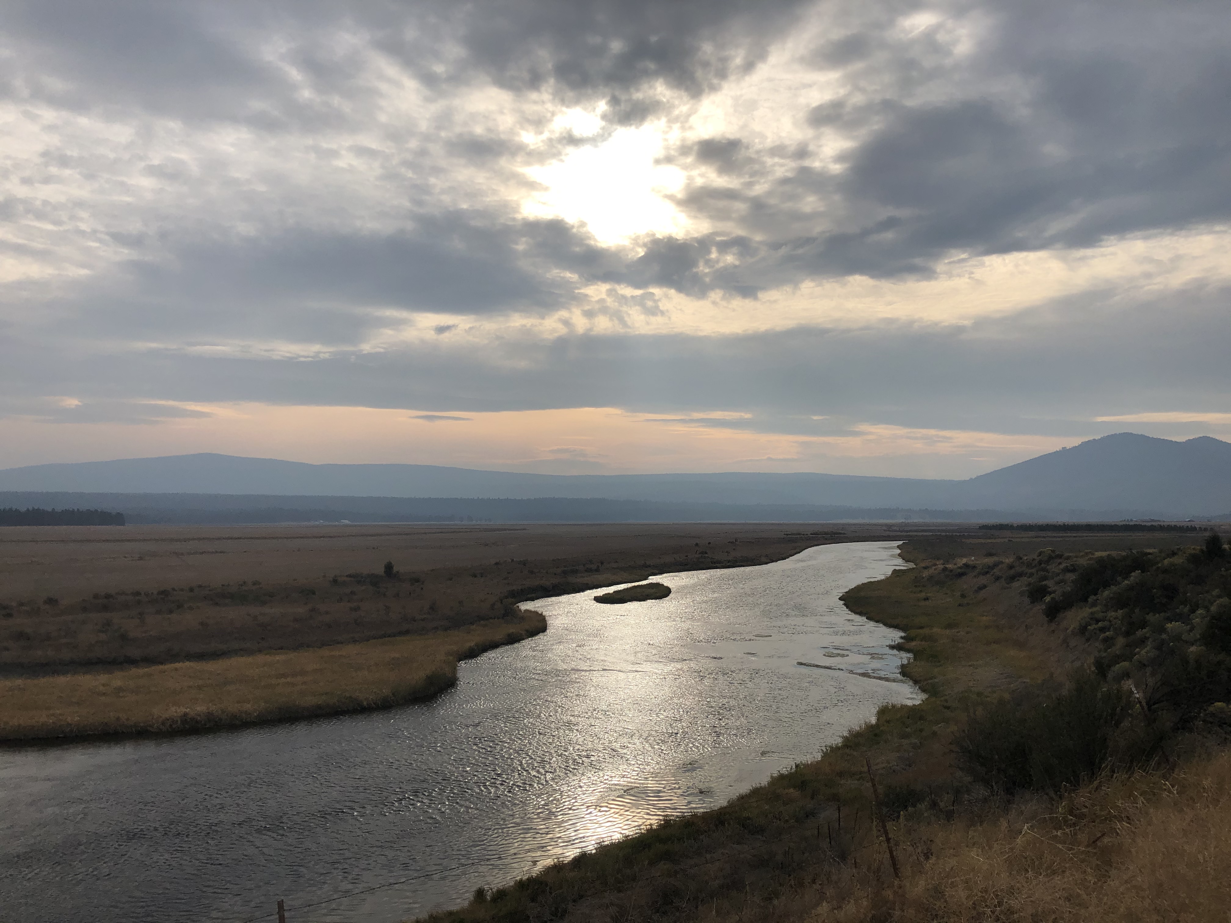 River runnign through open land