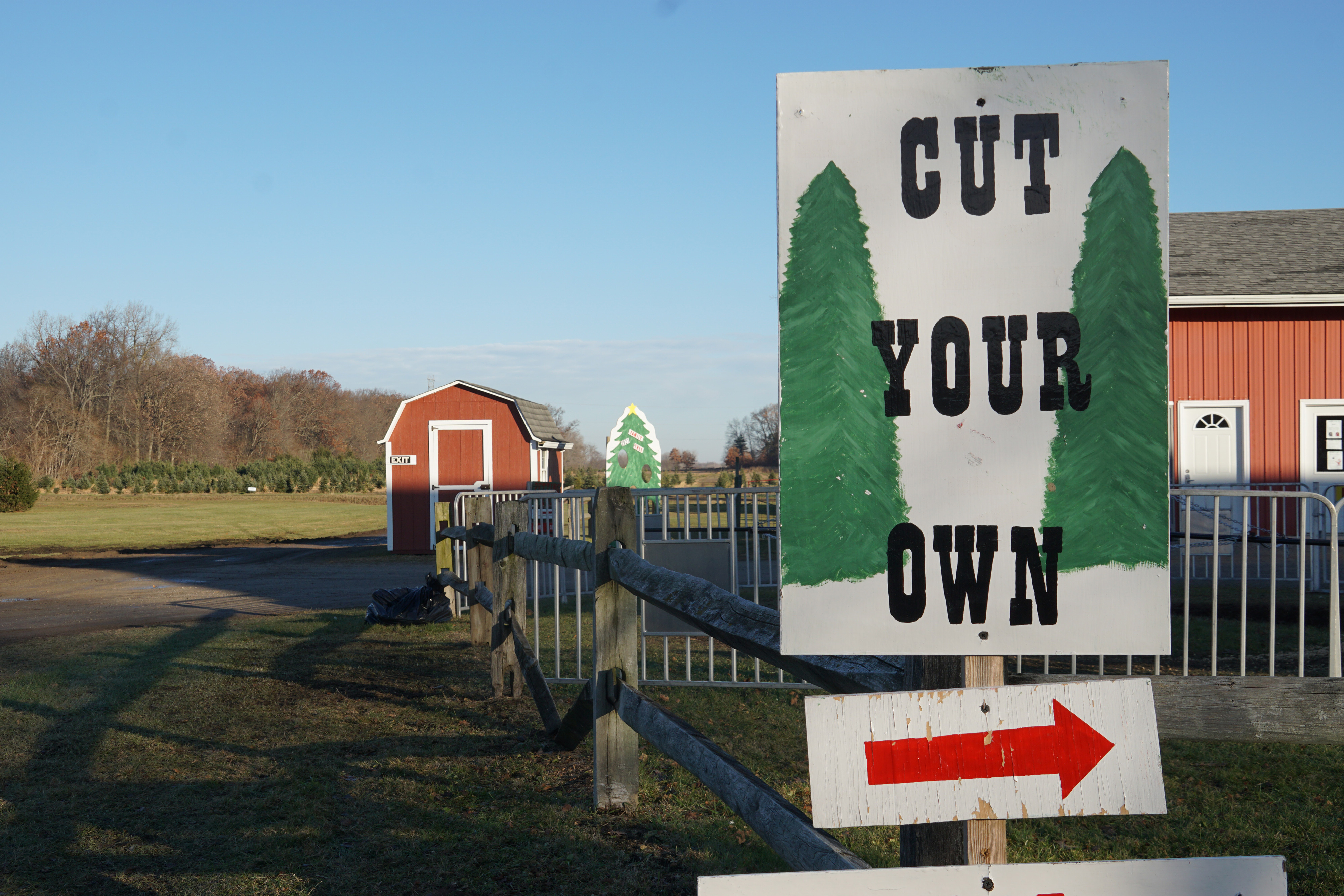 Sign saying cut your own with red directional arrow pointing right