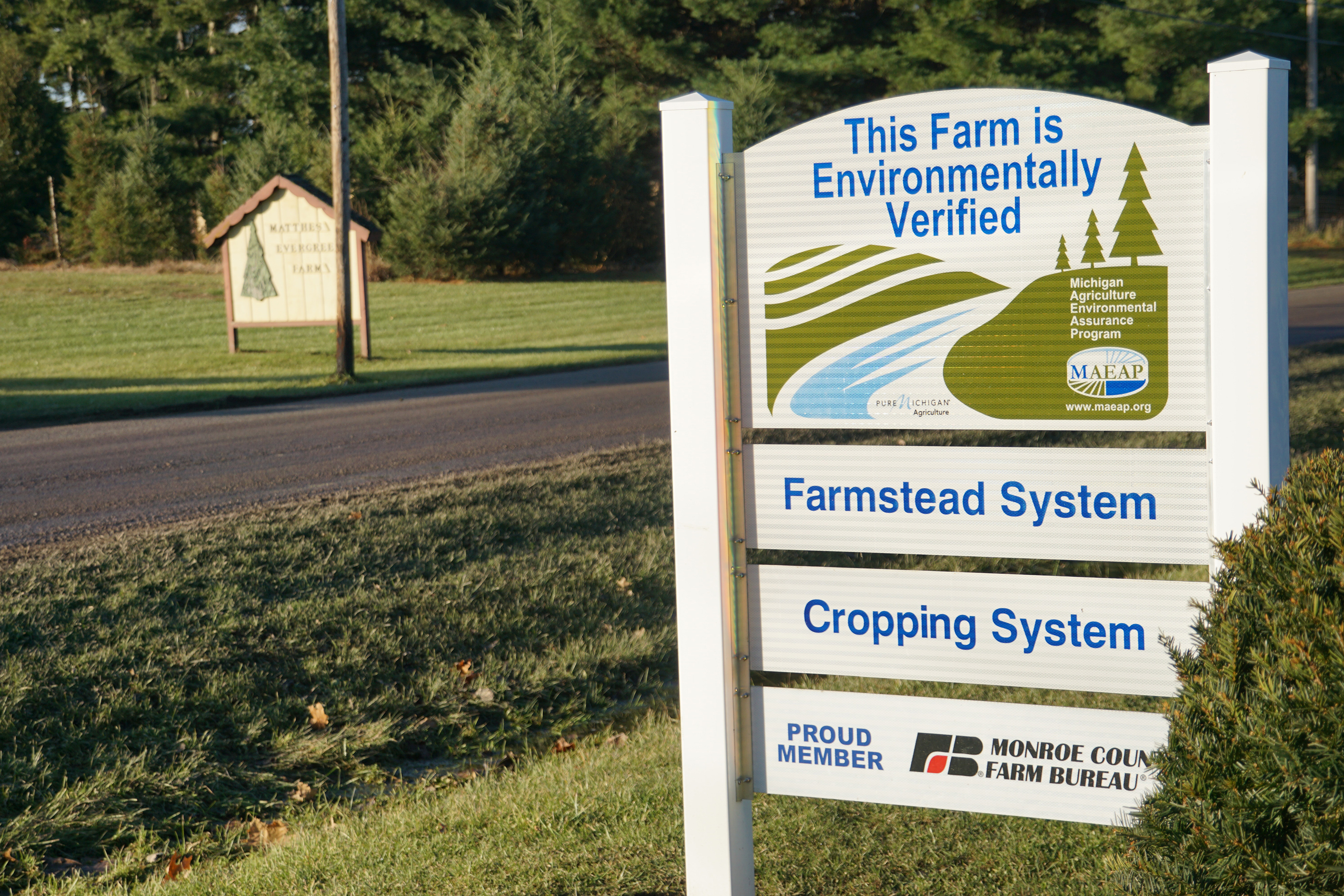 Sign indicating environmental practices at entrance to farm