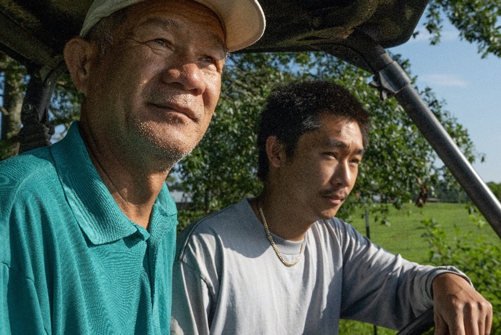 Two people driving cart