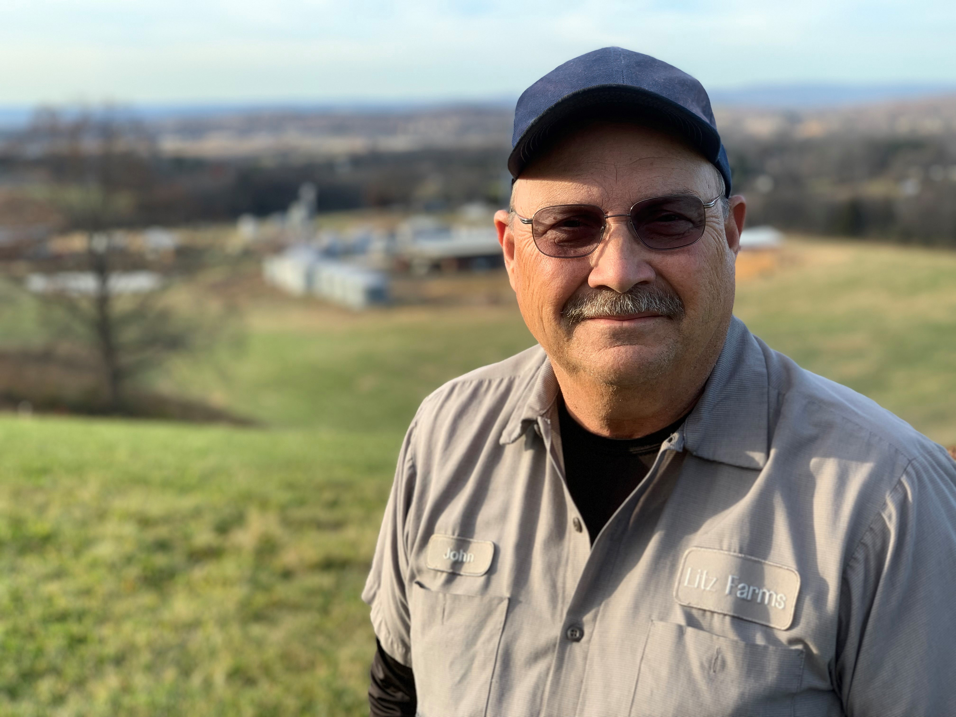 Person stands in field