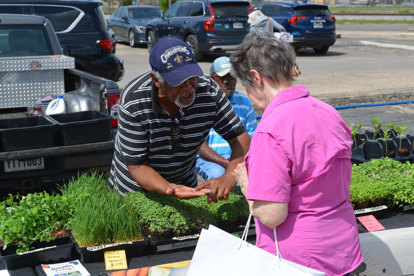 Person helping another person purchase plants