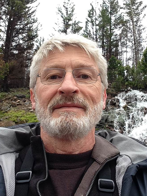 Head and torso of gray haired person