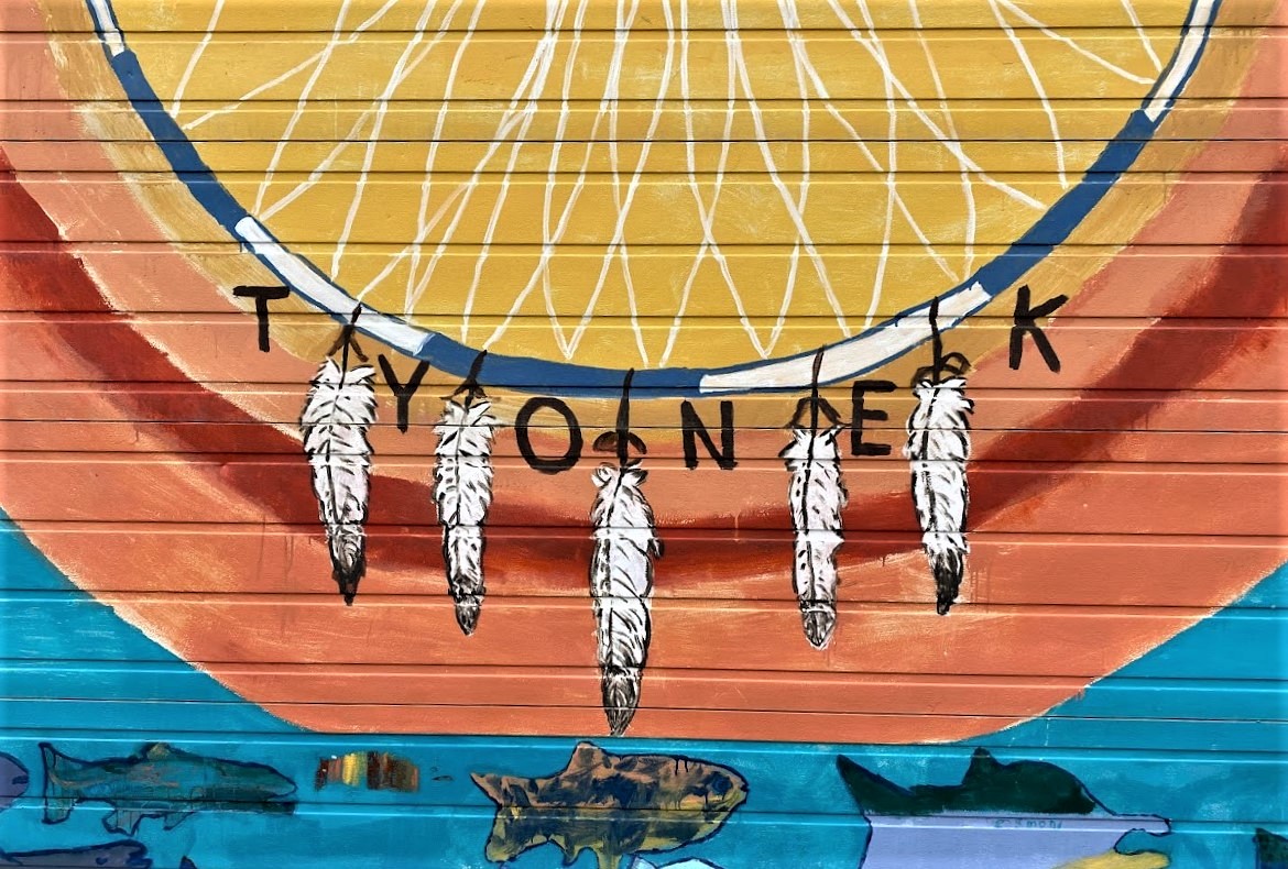 Native American dream catcher painted on wall of building