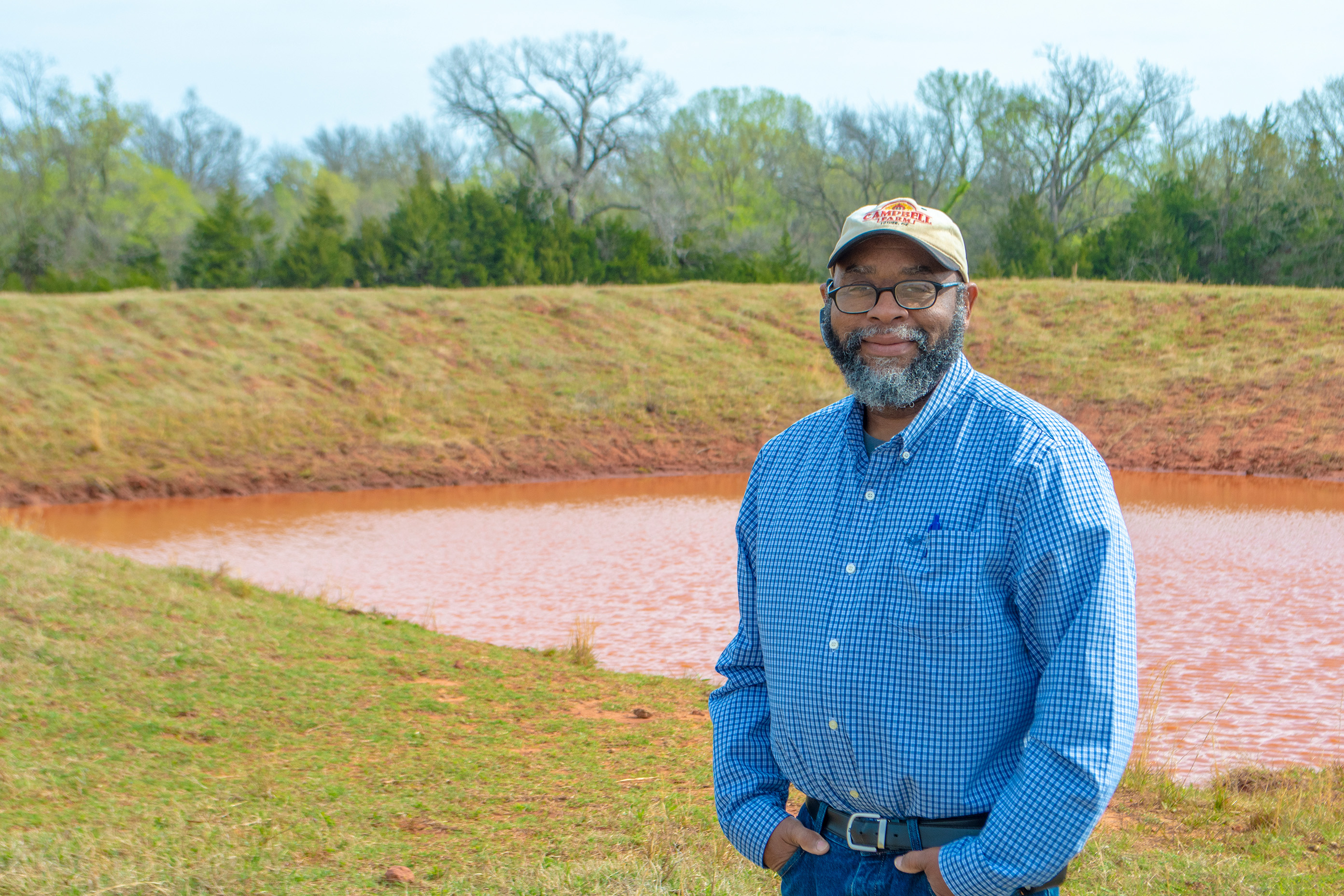 Person standing next to a water hole