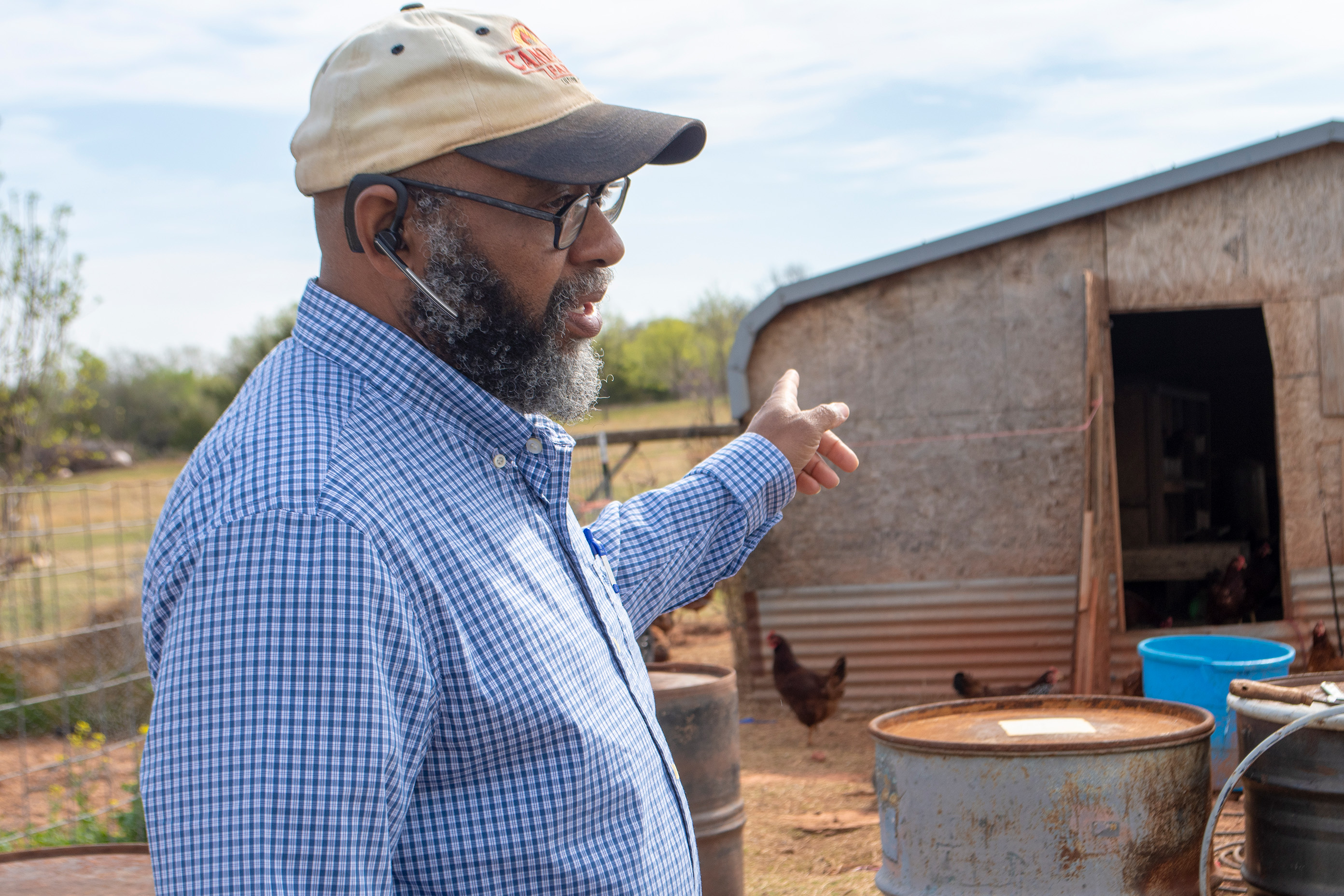 Person pointing towards chicken coop