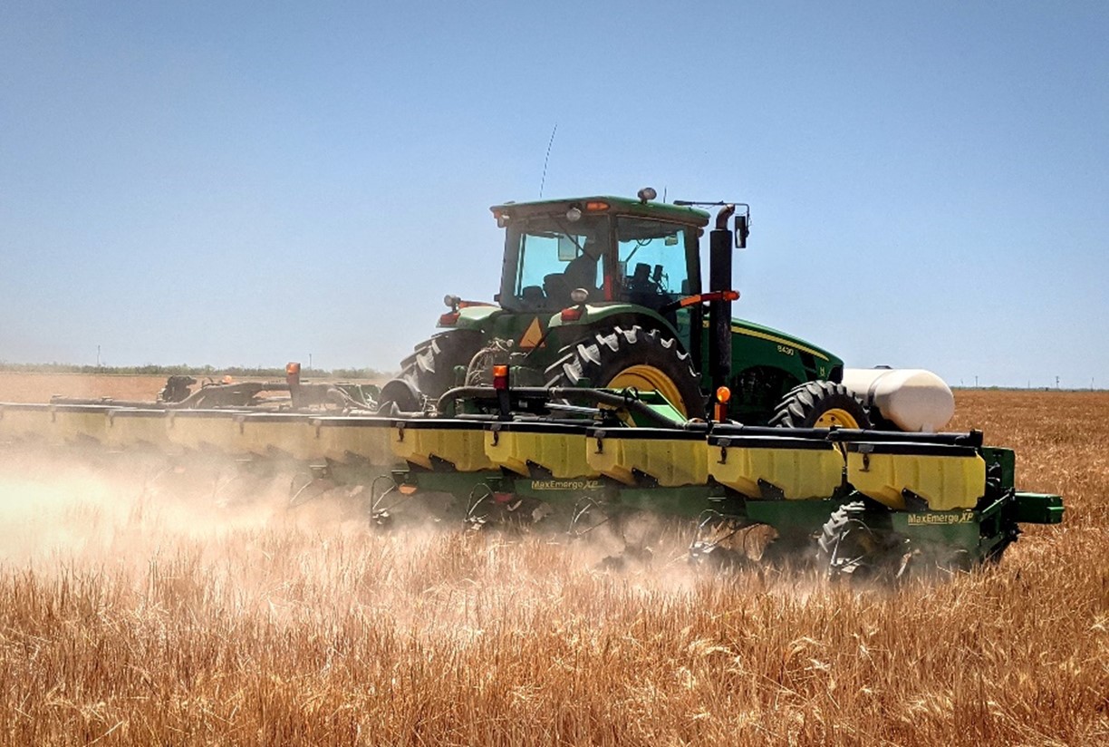 Tractor plowing field