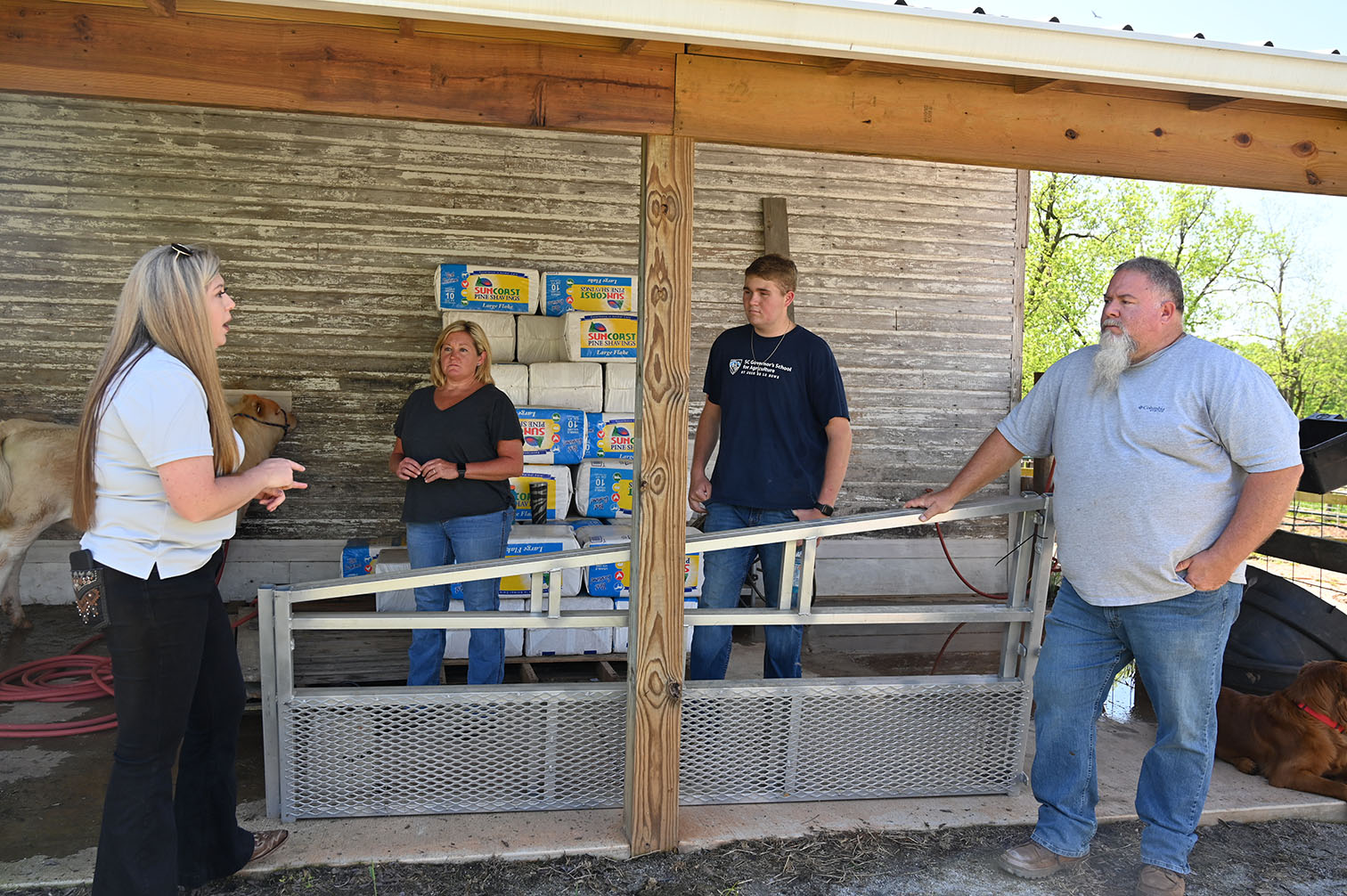 Four people talking to each other while standing