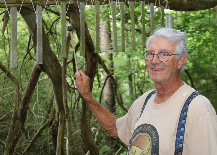 Person playing wind chimes