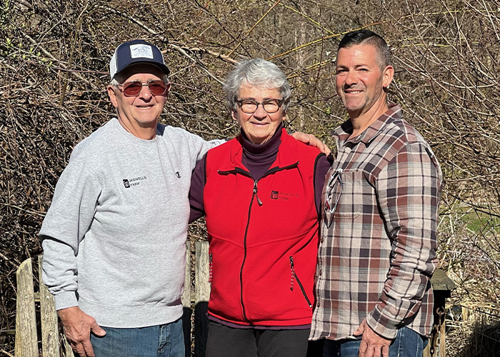 Three people smiling