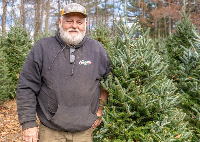 person standing in front of trees