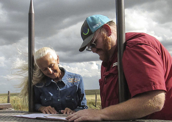 Two people reviewing plans