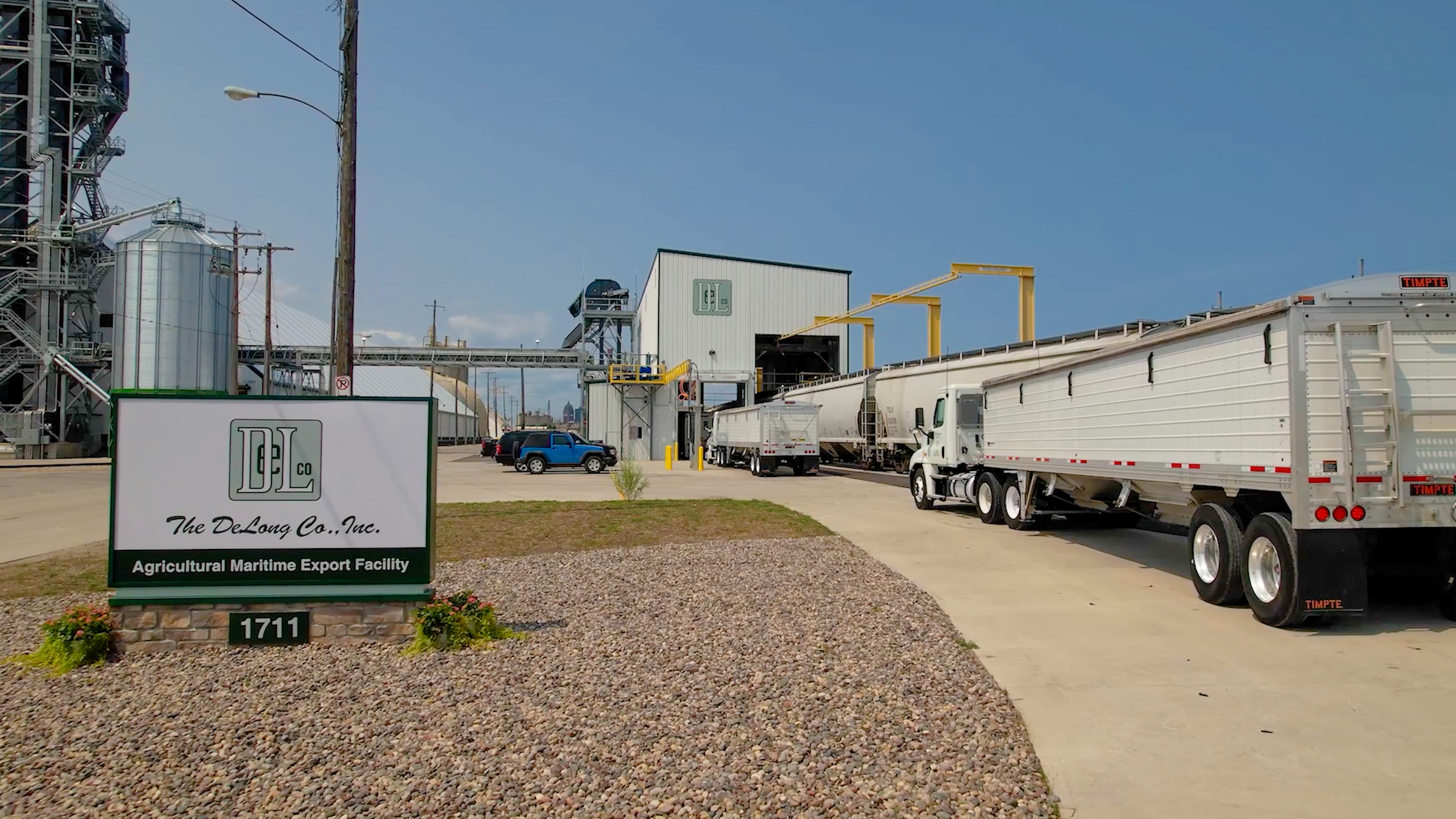 Several trucks pull into the export facility