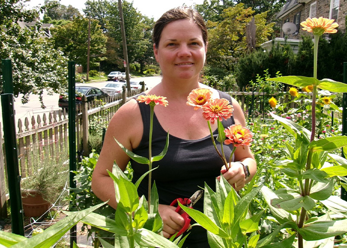 Person standing amongst flowers