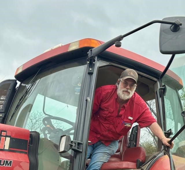 person sitting in tractor