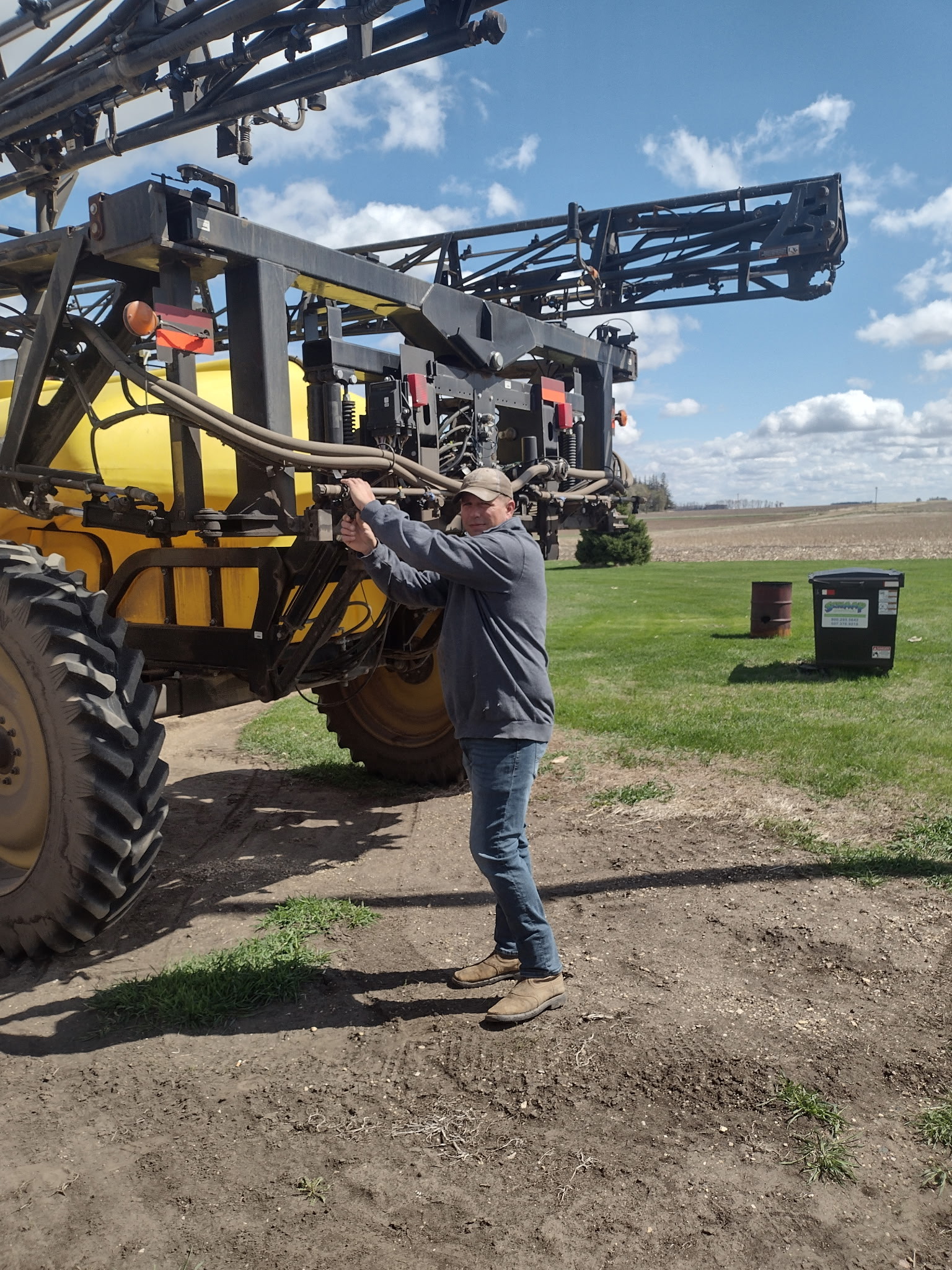 Person standing next to a tractor