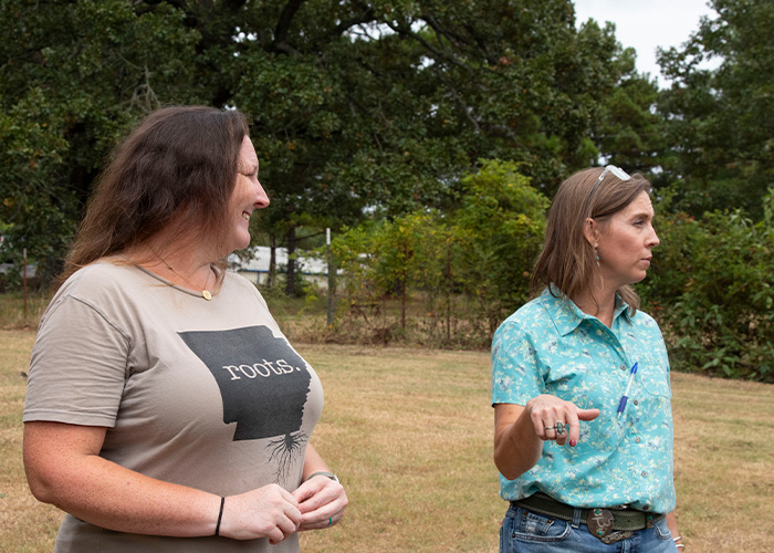 Two people standing in a field