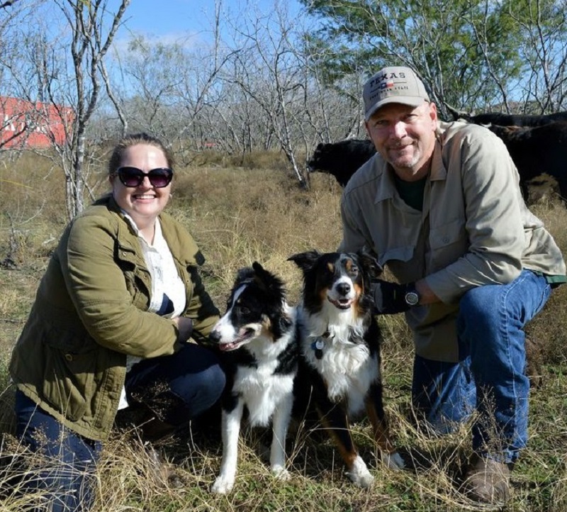 a farming family with their dogs