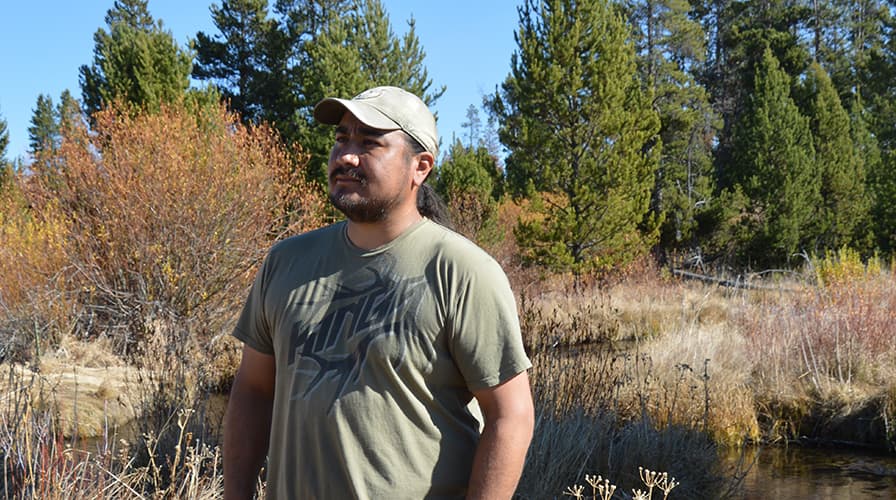 Eric Hawley, Burns Paiute Tribal chair observes the new growth along the banks of Big Creek.