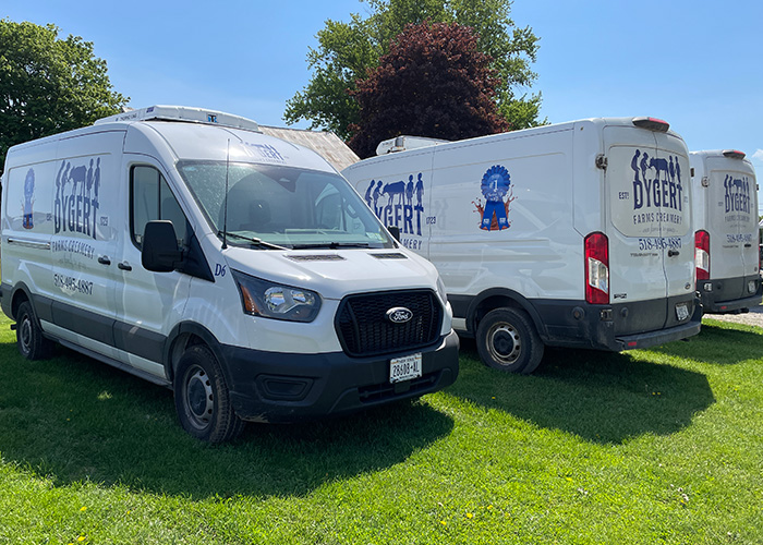 Three vans parked next to each other