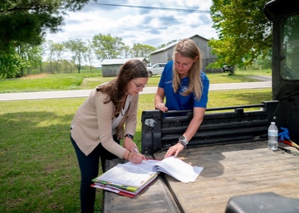 Two people reviewing documents