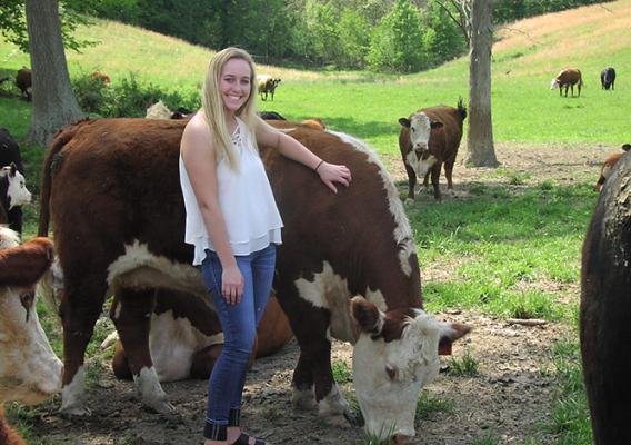 Payton Farmer stands with her herd. 
