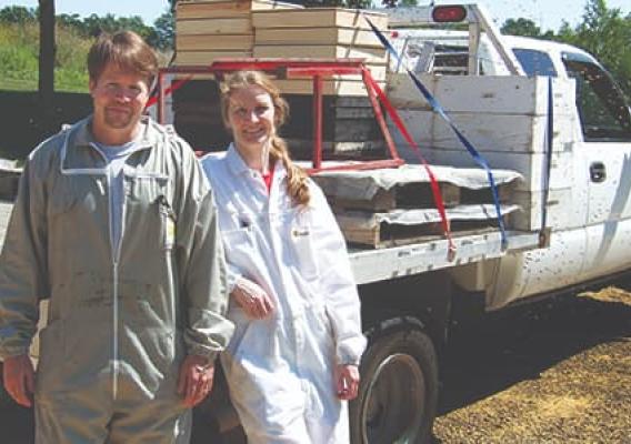 Tim McDonald and his wife, Dana, in front of a truck