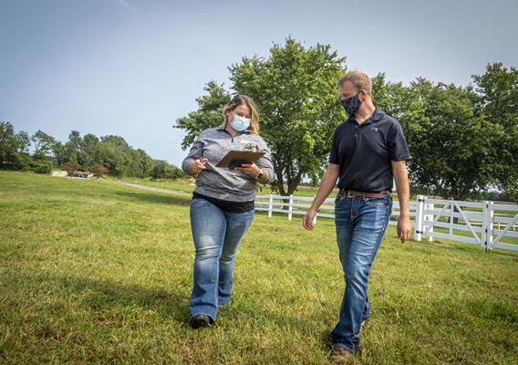 USDA staff assisting a customer.