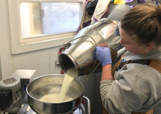 Woman pouring milk into storage container