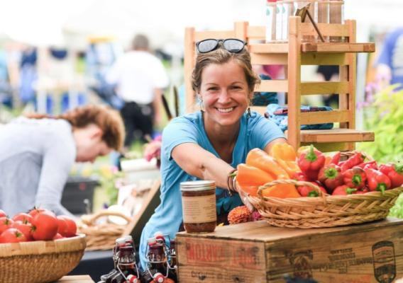 Person selling produce at outside market