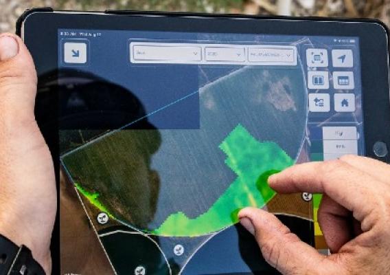 Person reviewing farmers dot gov tool on an ipad