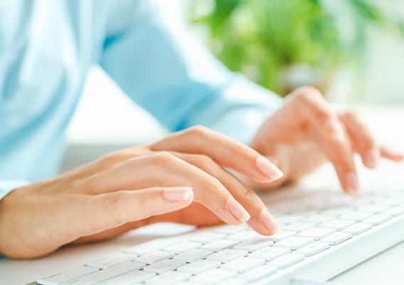 hands typing on computer key board