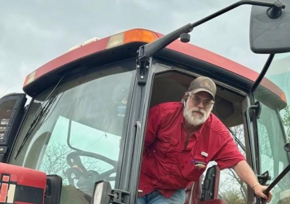 person sitting in tractor