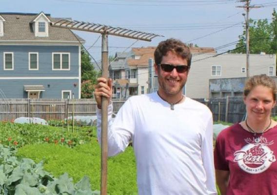 Carrie Nader and Alexander Wadsworth standing in front of their farm