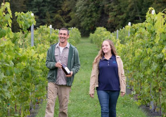 Andy and India walk in their vineyard