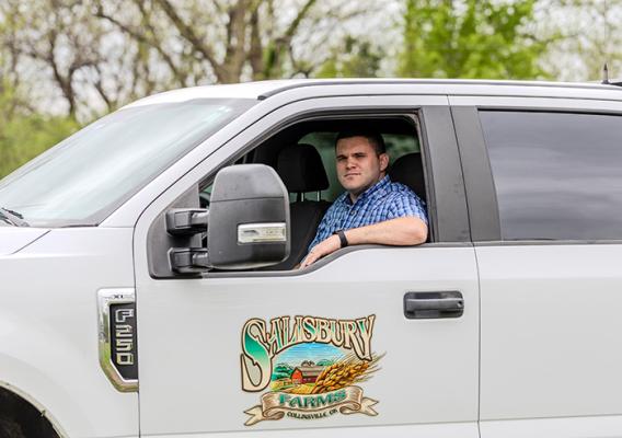 Person sitting in the driver's side of a truck