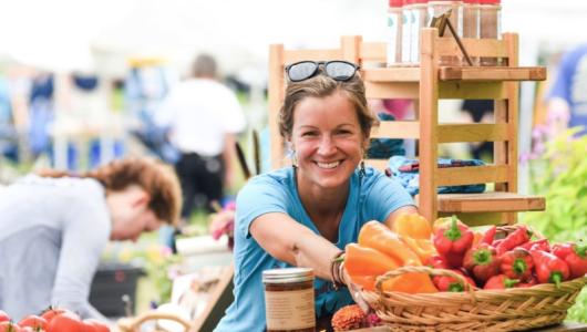 Person selling produce at outside market