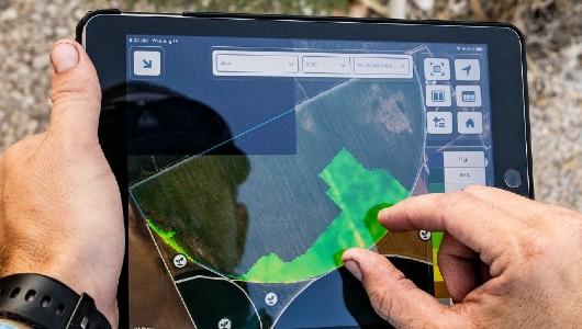 Person reviewing farmers dot gov tool on an ipad
