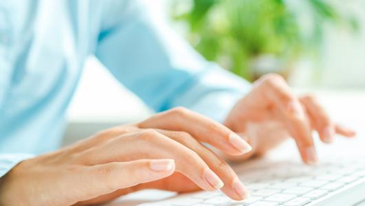 hands typing on computer key board
