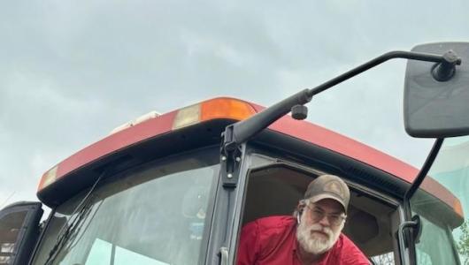 person sitting in tractor
